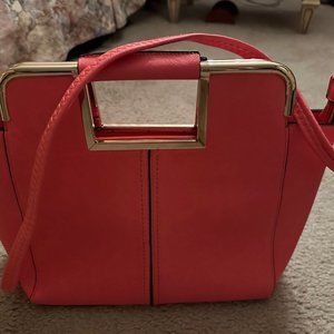 Orange handbag with fixed handle